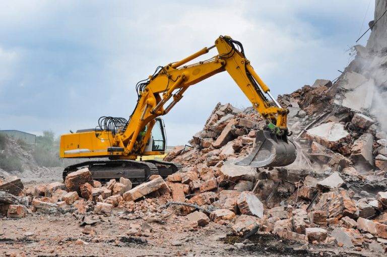 digger demolishing building